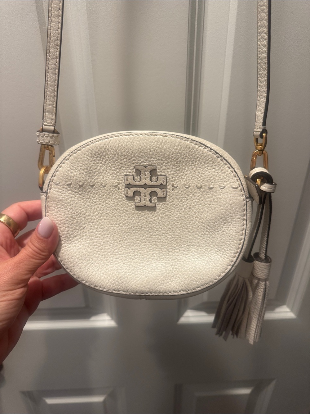 Tory Burch Cream Pebbled Leather Round Crossbody with Tassel
